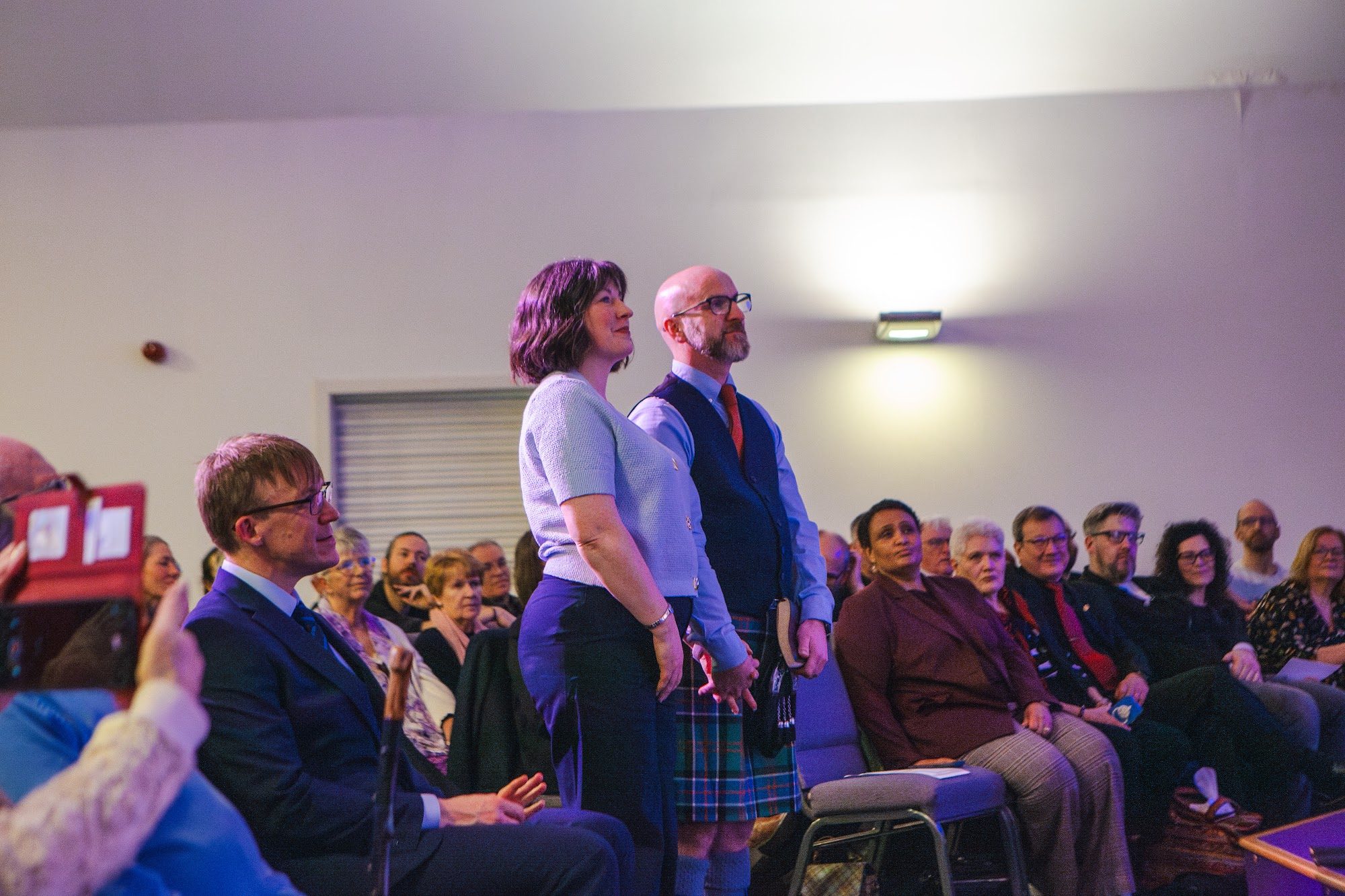 The ordinands standing among the congregation
